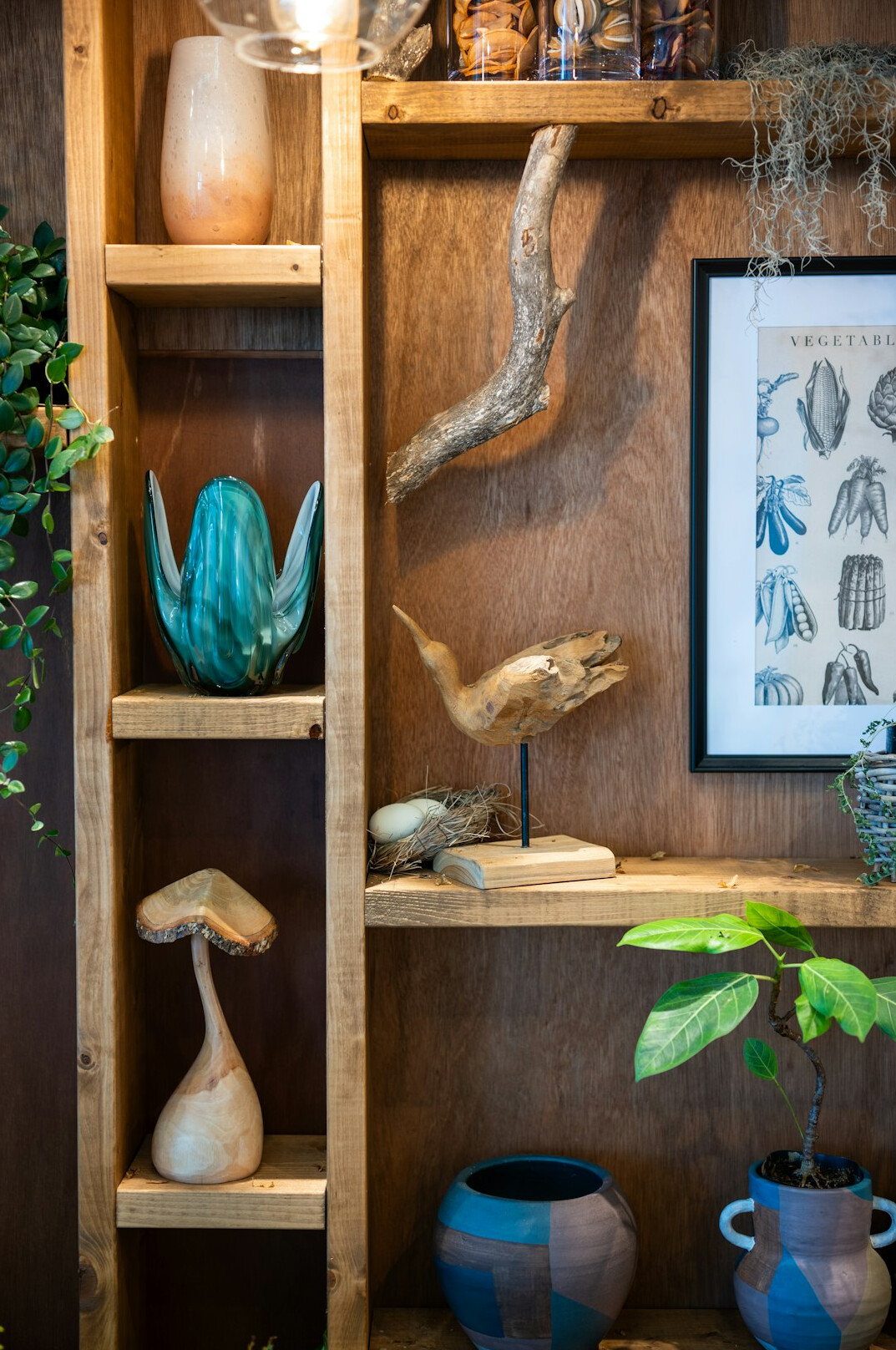 Leather bound anthology books on a wooden shelf