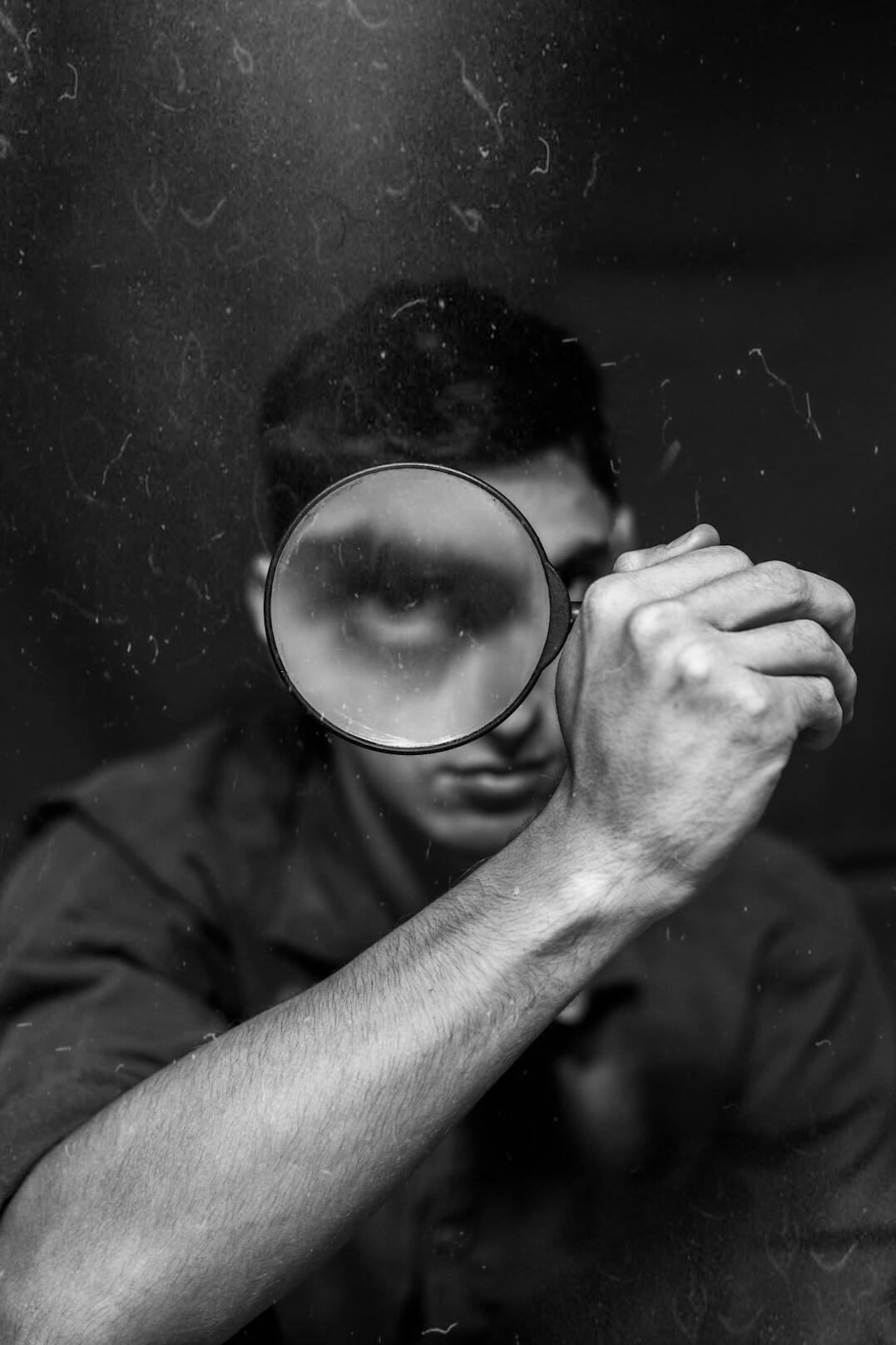 detective novel cover with magnifying glass