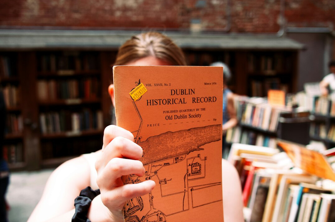 detective reading old book